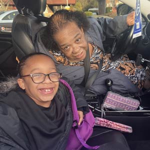 Photo of Sheila H and her granddaughter in a car