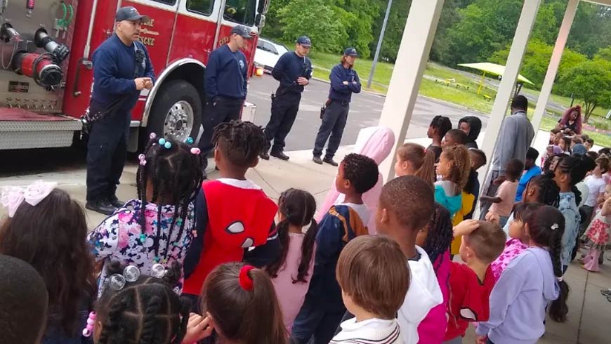 Photo Of Spring Valley Elementary Students With Firemen