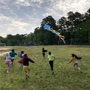 Photo of children flying a kite
