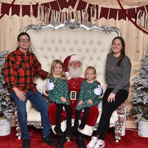 Photo of Stacie Budd and her family with Santa